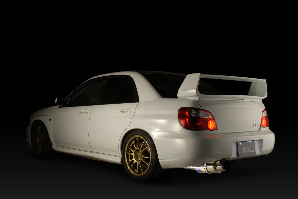 white sedan with spoilers and custom exhaust